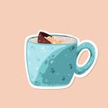 Blue cup with hot chocolate bomb sticker with marshmallow