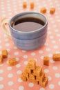 Blue cup of tea and lump sugar on pink background Royalty Free Stock Photo