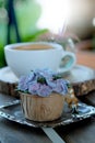 Blue cupcake design cream like blue Hydrangea flower Served with hot black coffee on wooden table background