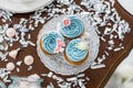 Blue cupcakes on wooden table