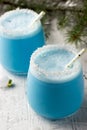 Blue curacao Christmas Cocktail on Christmas decorated holiday table Royalty Free Stock Photo