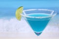 Blue Curacao cocktail on the beach with copyspace Royalty Free Stock Photo