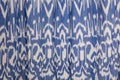 Blue curtain with geometric ethnic pattern, close up