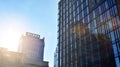 Blue curtain wall made of toned glass and steel constructions under blue sky. A fragment of a building. Royalty Free Stock Photo