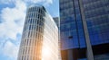 Blue curtain wall made of toned glass and steel constructions under blue sky. A fragment of a building. Royalty Free Stock Photo