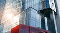 Blue curtain wall made of toned glass and steel constructions under blue sky. A fragment of a building. Royalty Free Stock Photo