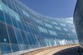 Blue curved glass wall with passage Royalty Free Stock Photo