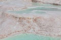 Blue cyan water travertine pools at ancient Hierapolis, now Pamukkale, Turkey Royalty Free Stock Photo