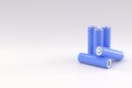 5 blue cylindrical batteries on a light gray background. Storage battery or secondary cell. Rechargeable li-ion