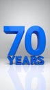 Blue 3D '70 YEARS' text with reflection on a clean white background, celebrating a significant milestone. Royalty Free Stock Photo