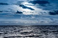 Blue dark dramatic sky shining ocean