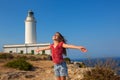 Blue day with kid girl open hands to the wind