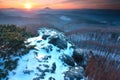 Blue daybreak, thawing of snow. Sandstone cliff misty valley