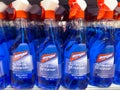 Blue de-icer bottles on store shelf with orange spray nozzles Royalty Free Stock Photo
