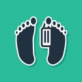 Blue Dead body with an identity tag attached in the feet in a morgue of a hospital icon isolated on green background Royalty Free Stock Photo