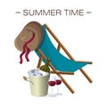 Blue deckchair with a wide-brimmed summer hat hanging on it. Bucket cooler for wine with bottle and two glasses with drink