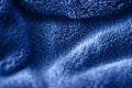 Blue delicate soft background of fur plush smooth fabric. Texture of fleecy blanket textile