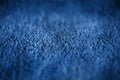 Blue delicate soft background of fur plush smooth fabric. Texture of fleecy blanket textile