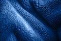 Blue delicate soft background of fur plush smooth fabric. Texture of fleecy blanket textile Royalty Free Stock Photo