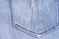 Blue denim. Cotton fabric, jeans. Creative vintage background. Pocket and zipper. The line is of poor quality. Cheap item Royalty Free Stock Photo