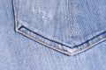 Blue denim. Cotton fabric, jeans. Creative vintage background. Pocket and zipper. The line is of poor quality. Cheap item Royalty Free Stock Photo