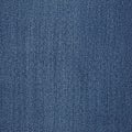 Blue denim fabric with a twill weave pattern. The texture shows a diagonal ribbing Royalty Free Stock Photo