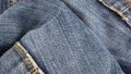 Blue denim fabric with visible details. textura or background