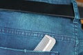 Blue denim jeans in dark color with comb in the scene present th Royalty Free Stock Photo
