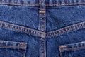 Blue denim jeans texture with seams and pockets Royalty Free Stock Photo