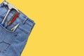 Blue denim jeans with tools. Copy space concept Royalty Free Stock Photo