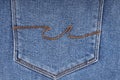blue denim texture with side double seam. thread stitches on the background of denim textiles. a place to copy. Abstract