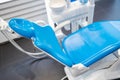 Blue dental chair in the office. Royalty Free Stock Photo