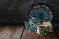 Blue designed Chinaware Teapot set table top on wooden background