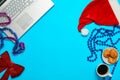 Blue desk with laptop, office items coffe and Santa cup Royalty Free Stock Photo