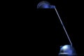 Blue desklamp on black Royalty Free Stock Photo