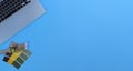 Blue desktop with architect designer tools consisting of paint brush, paint sample cards and laptop Royalty Free Stock Photo