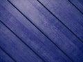 Blue diagonal interior design wooden slat wall wood panel designer decor closeup painted background