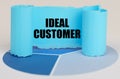 On the blue diagram is a twisted paper sign with the inscription - IDEAL CUSTOMER