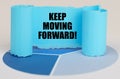 On the blue diagram is a twisted paper sign with the inscription - KEEP MOVING FORWARD