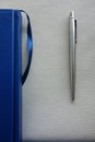 The blue diary and pen are on the table Royalty Free Stock Photo