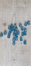 An aerial view of blue dice spread around showing different values Royalty Free Stock Photo