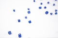 Blue Dice falling on a white background