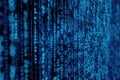 Blue digital binary code streaming on a computer screen, creating a futuristic and high-tech background Royalty Free Stock Photo