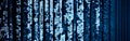 Blue digital binary data on computer screen with bokeh. Abstract information technology background. Digital binary code matrix Royalty Free Stock Photo