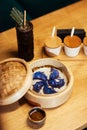 Blue Dim Sum chinese cuisine in bamboo steamer and pot. Top view fresh dumplings with hot steams on wood plate with Royalty Free Stock Photo