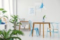 Blue dining room with plants