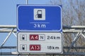 Blue direction and information sign for the directions on Motorway A12 heading junction  to Petrol station and parking lot Royalty Free Stock Photo