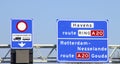 Blue direction and information sign for the directions on Motorway A16 Nesselande and Gouda Royalty Free Stock Photo