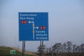 Blue direction sign on motorway A12 heading to Den Haag and Zoetermeer in the Netherlands