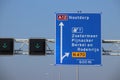 Blue direction sign on motorway A12 heading to Den Haag and Zoetermeer in the Netherlands